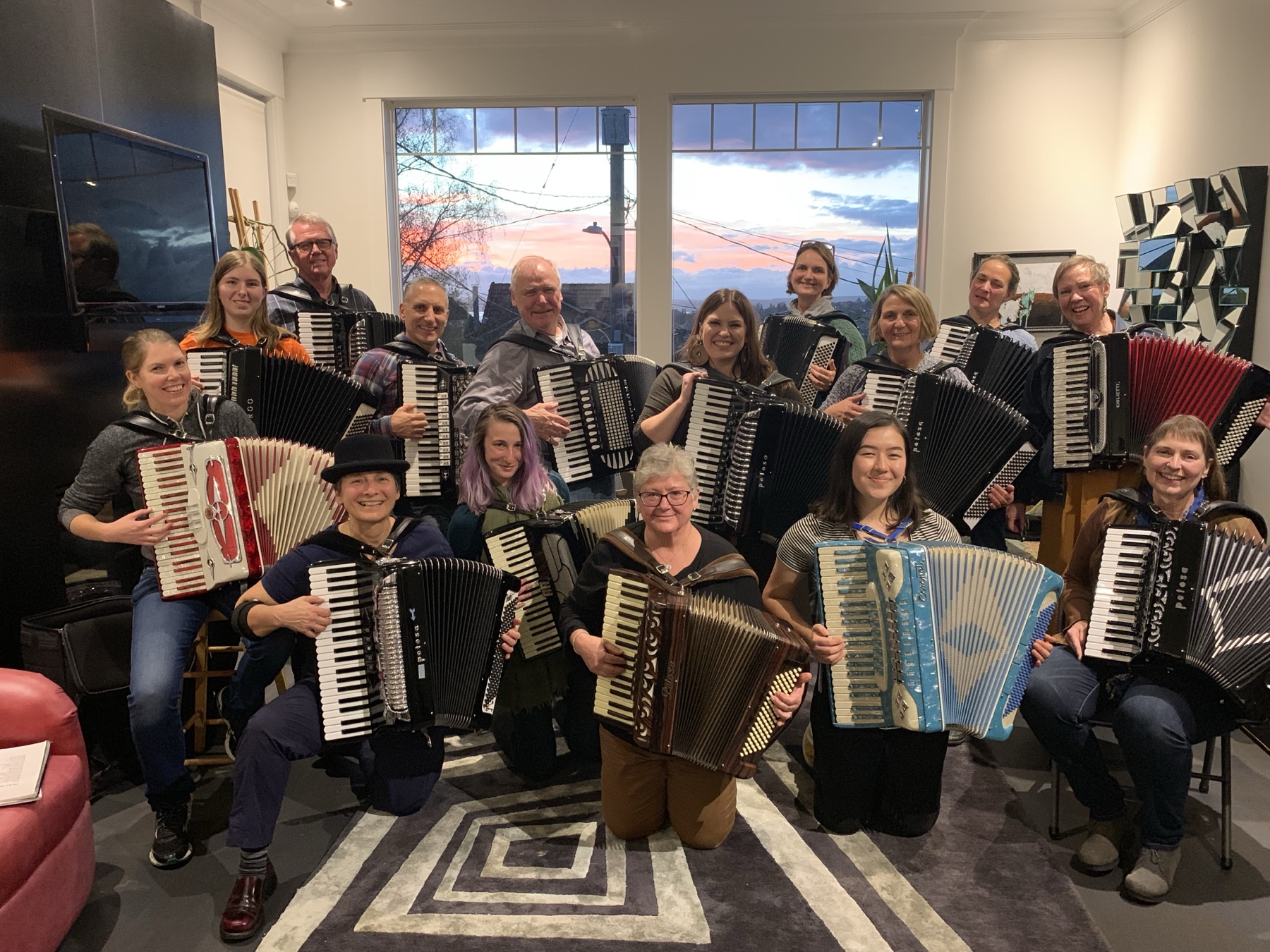 Accordion soirée gathering with players holding their instruments
